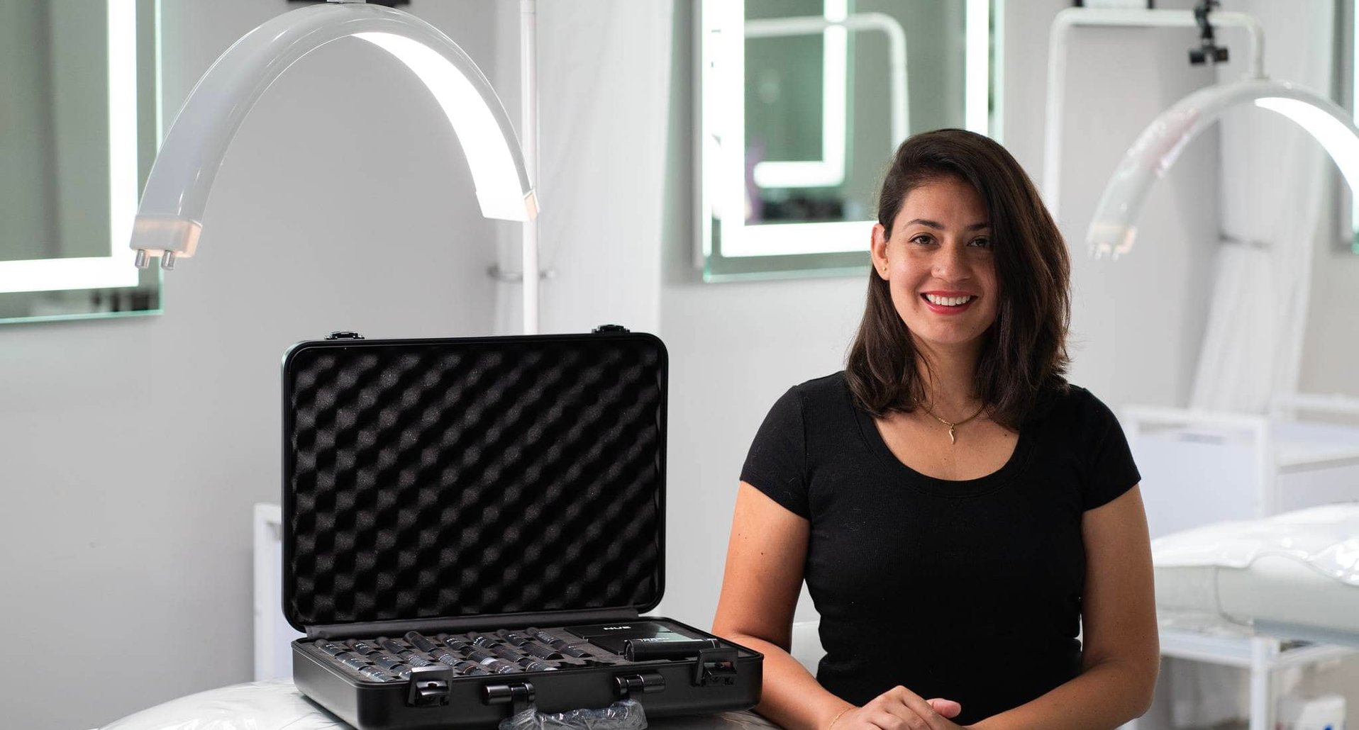 Artist working at her tattoo desk in the studio