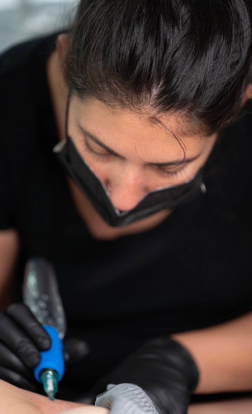 Professional tattoo aftercare balm application