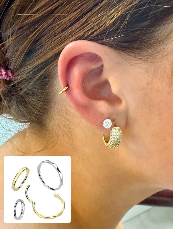 Ear piercing with gold jewelry