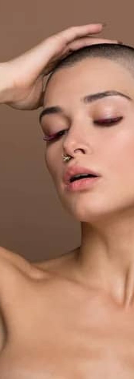 Woman posing with glowing skin after treatment