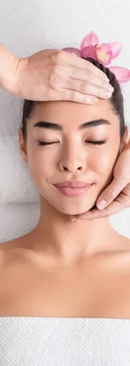 Woman smiling during skincare session