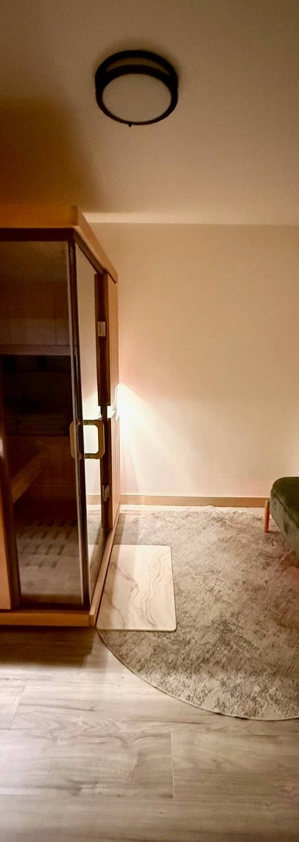 Beauty treatment room with warm lighting and decor